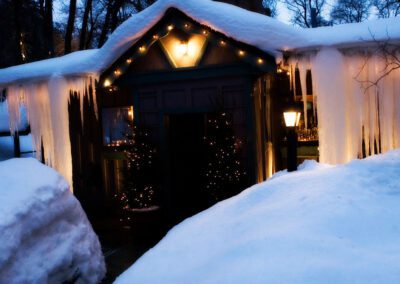 Front door of Millcreek Inn covered in snow.