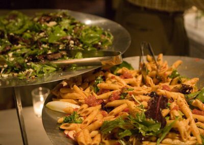 Buffet pasta side dishes in silver platters