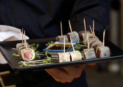 Sushi served on a black plate
